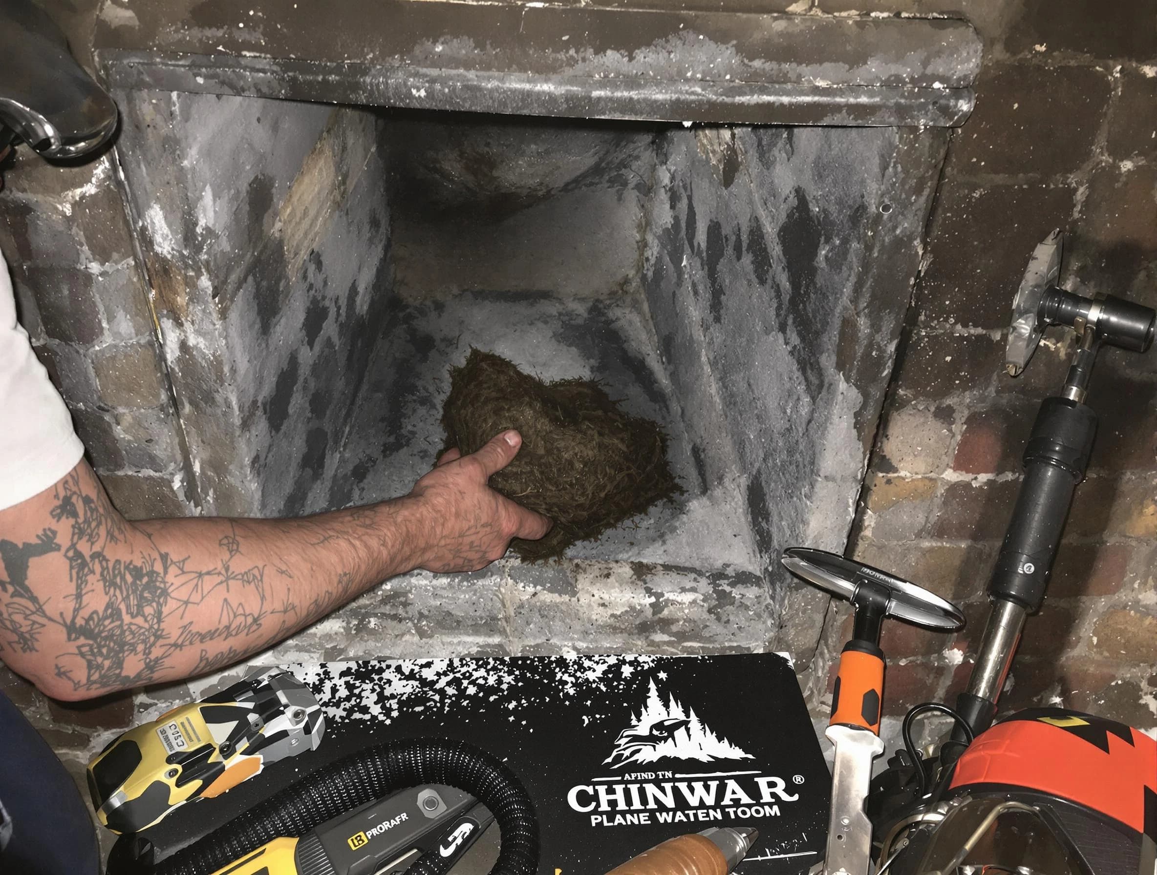 Tyrone Chimney Sweep safely removing debris and screening chimney in Tyrone, GA